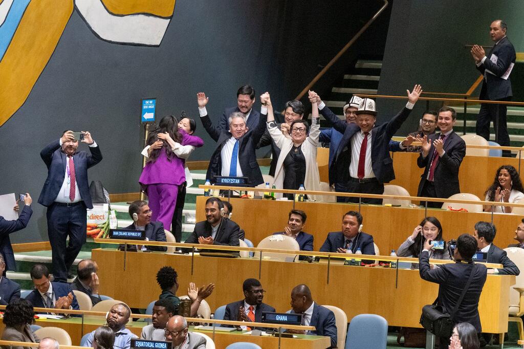 The delegation of Kyrgyzstan celebrate after being elected as a non-permanent member of the Security Council for a two-year term beginning in January 2027.
